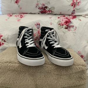 Black and white “Old Skool” high top vans.